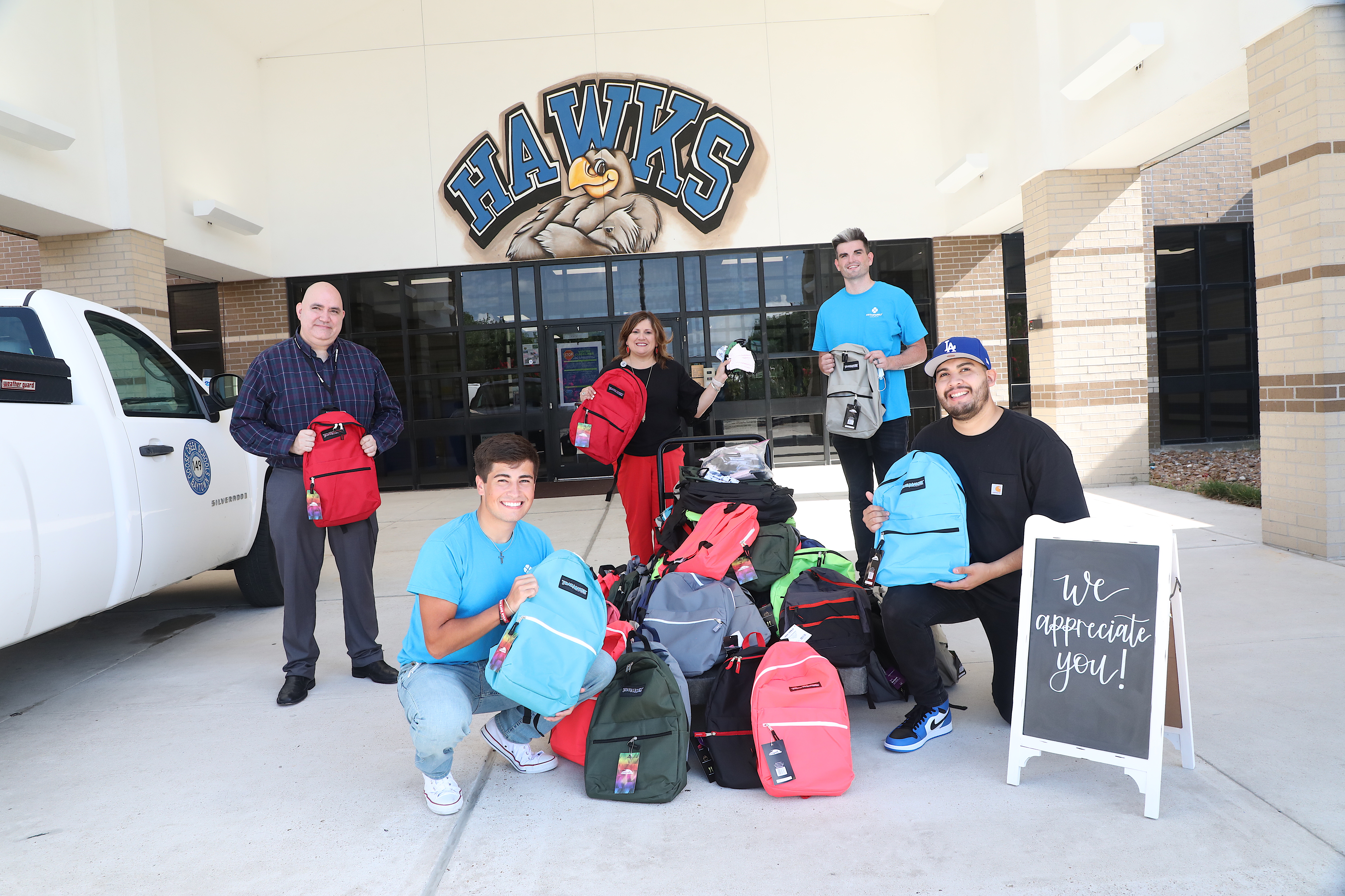 Faith Family Church poses with donations