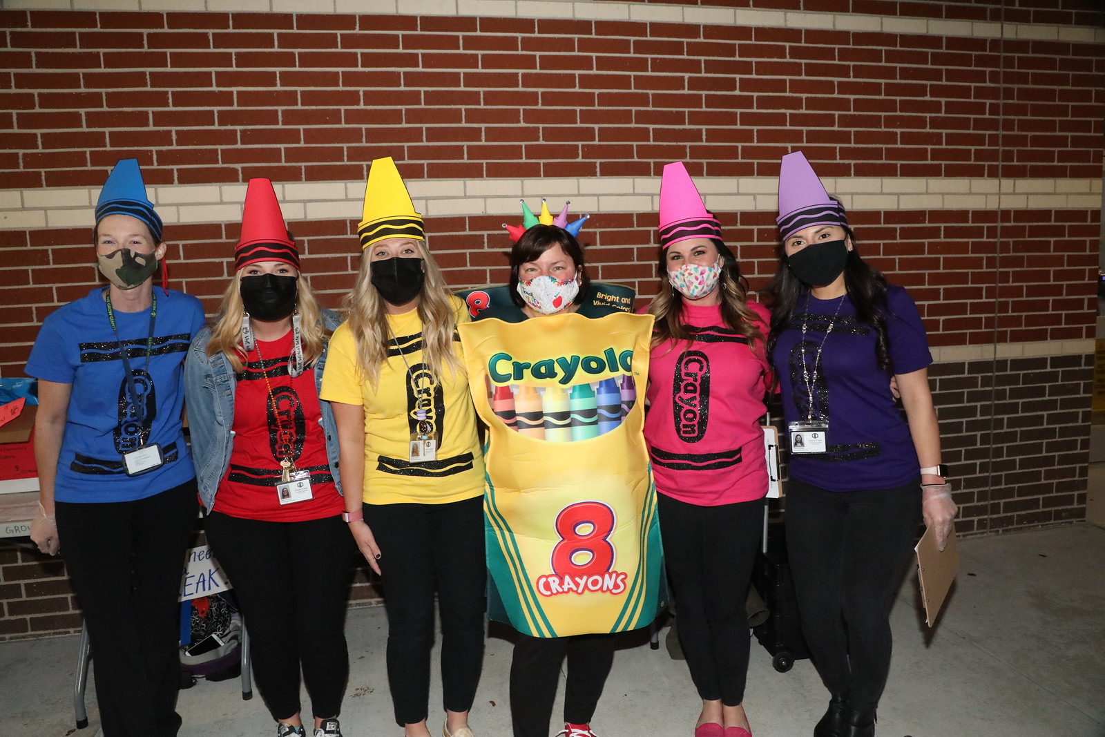 staff dressed up as crayons for literacy night