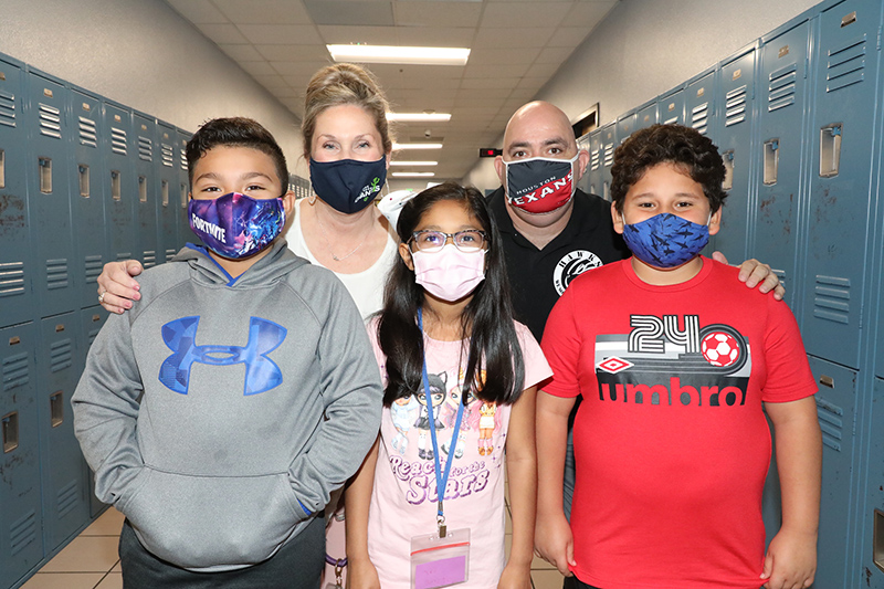 Assistant principals and students at Highlands Elementary