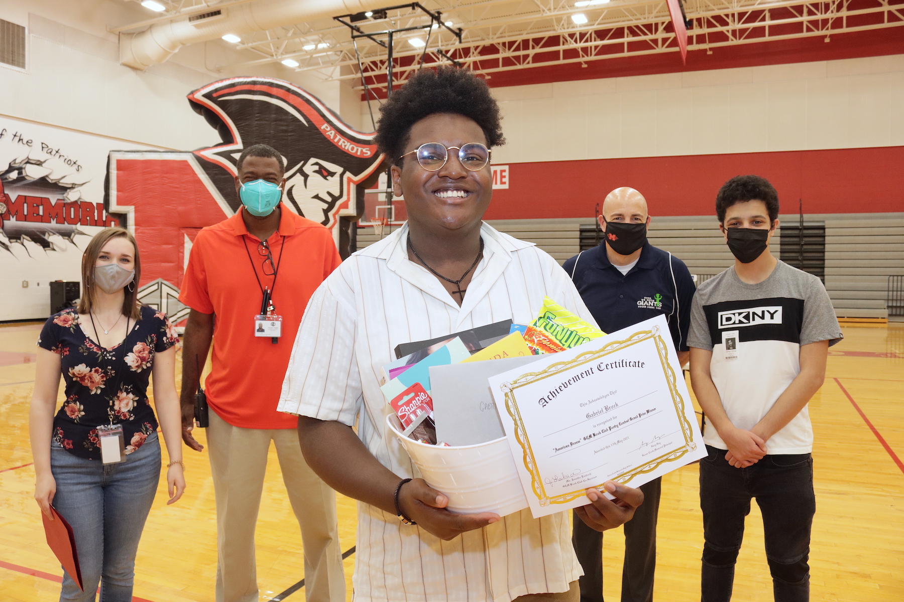 Poetry Contest Winner poses with award
