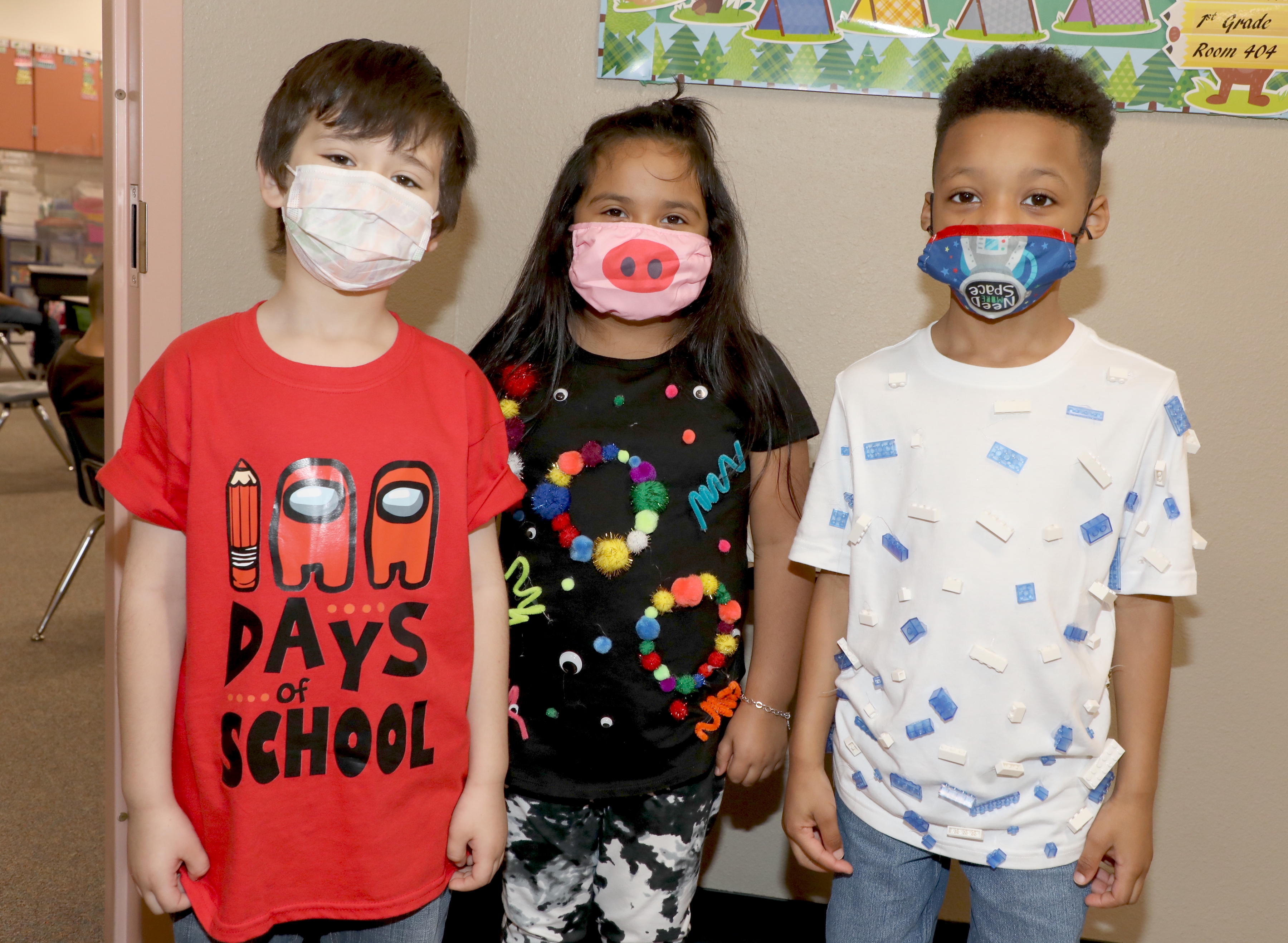 Student pose with 100 day shirts