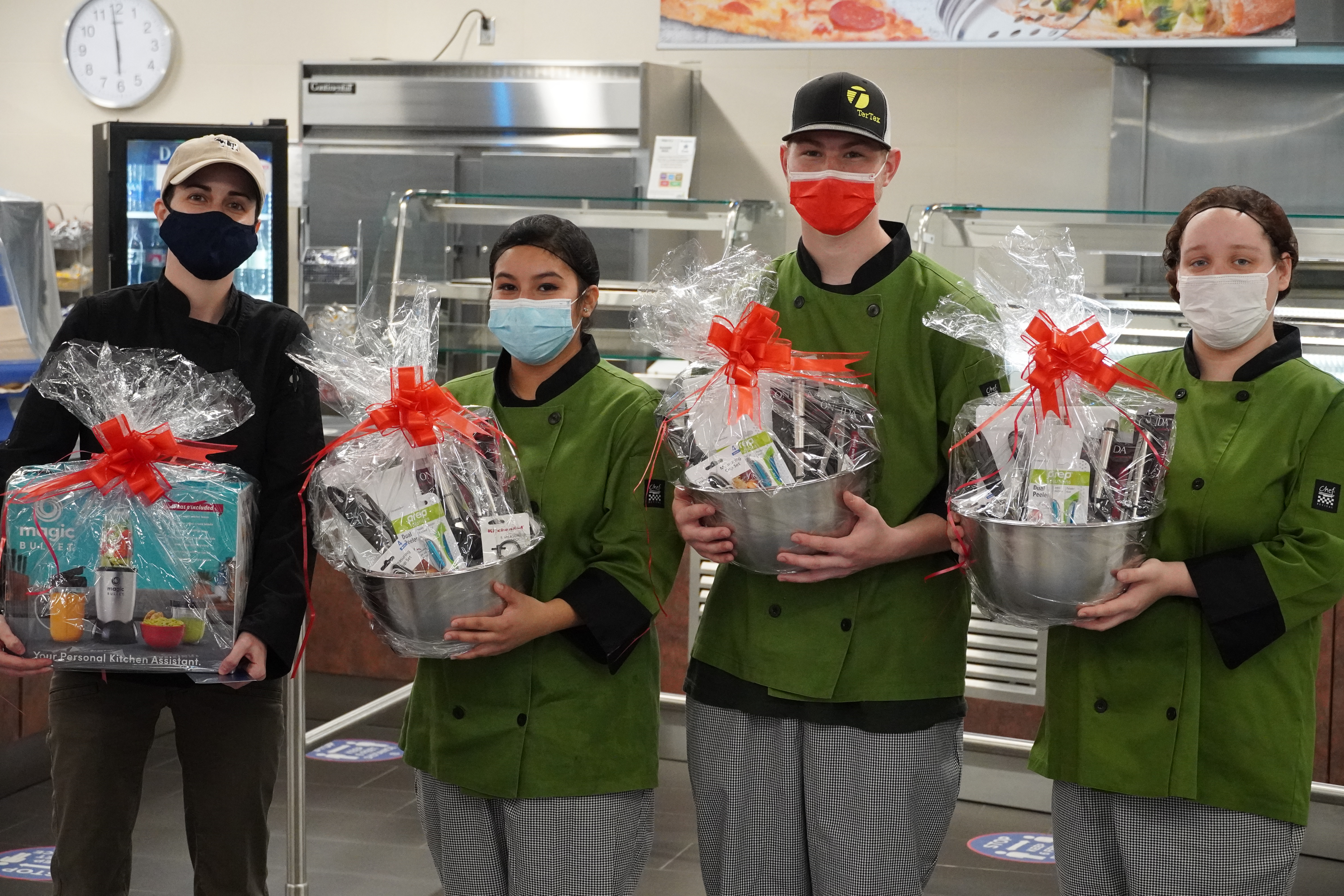 Winning students pose with prize baskets