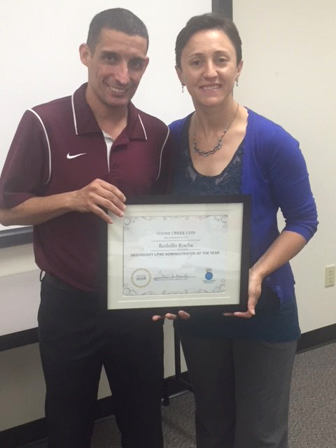 
Pilar Moreno-Recio (right), director of bilingual education, recognizes Redolfo “Rudy” Rocha, assistant principal at Robert E. Lee High School, as Goose Creek CISD’s Secondary Language Proficiency Assessment Committee (LPAC) Administrator of the Year.
