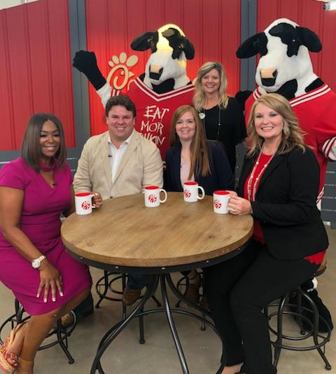 
Kelley Start (right), CTE specialist at Goose Creek Memorial High School and Leader Academy sponsor, prepares for an interview for “Great Day Houston” at the KHOU-TV studio with (from left) Debra Duncan, host; Taylor Henckel, Javonna Roach and Susan Harper from Chick-fil-A and the Chick-fil-A cows.
Students from GCM won the Chick-fil-A Leader Academy 2017 Do Good December contest with an activity from their Global Business Academy Capstone Project involving a video of “12 Gifts of Christmas.” Gifts were given to families in need to brighten their holidays. The segment will air Tuesday, August 14, at  9 a.m. on Channel 11.
