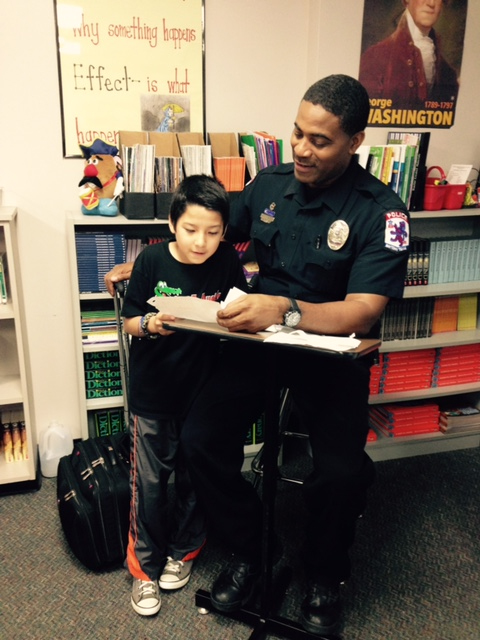 Student Reads Questions to DARE Officer 