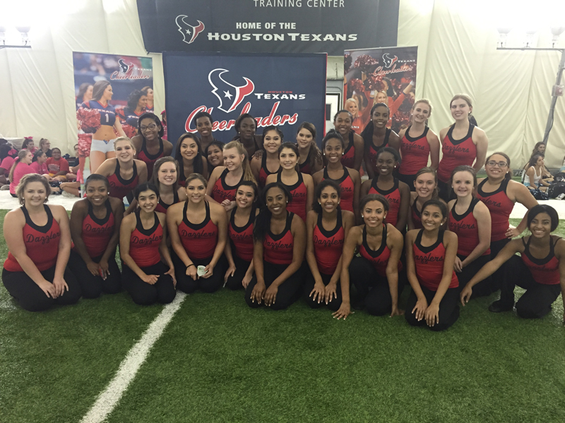 Dazzlers pose at football game