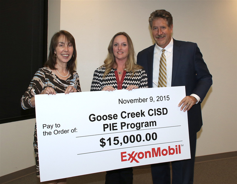 Exxon donates $15K to PIE Program. Board President, Laurie Terry and Superintendent receive donation