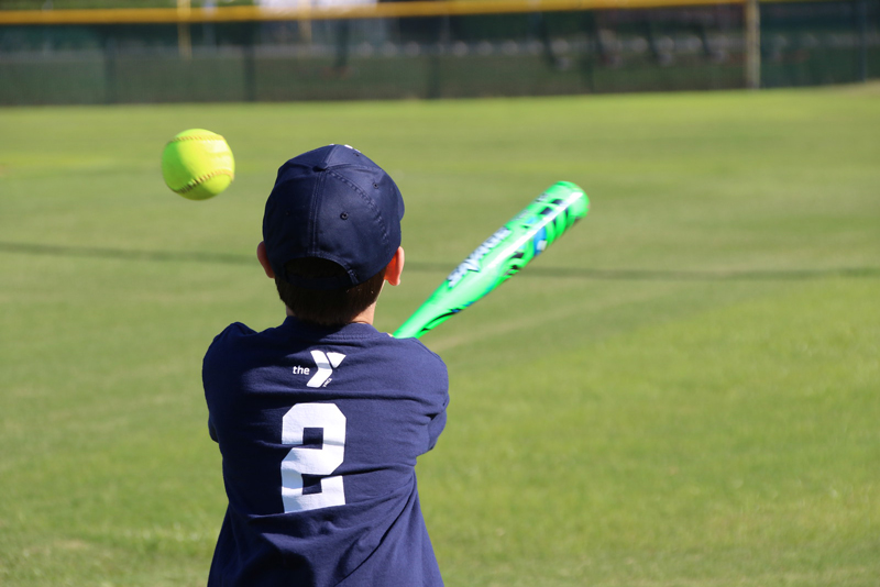 Miracle League Member hits the baseball