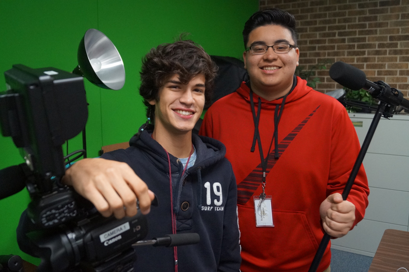 2 Stuart Career Students pose camera equipment