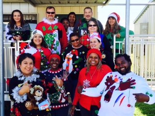 Transportation staff pose in holiday attire