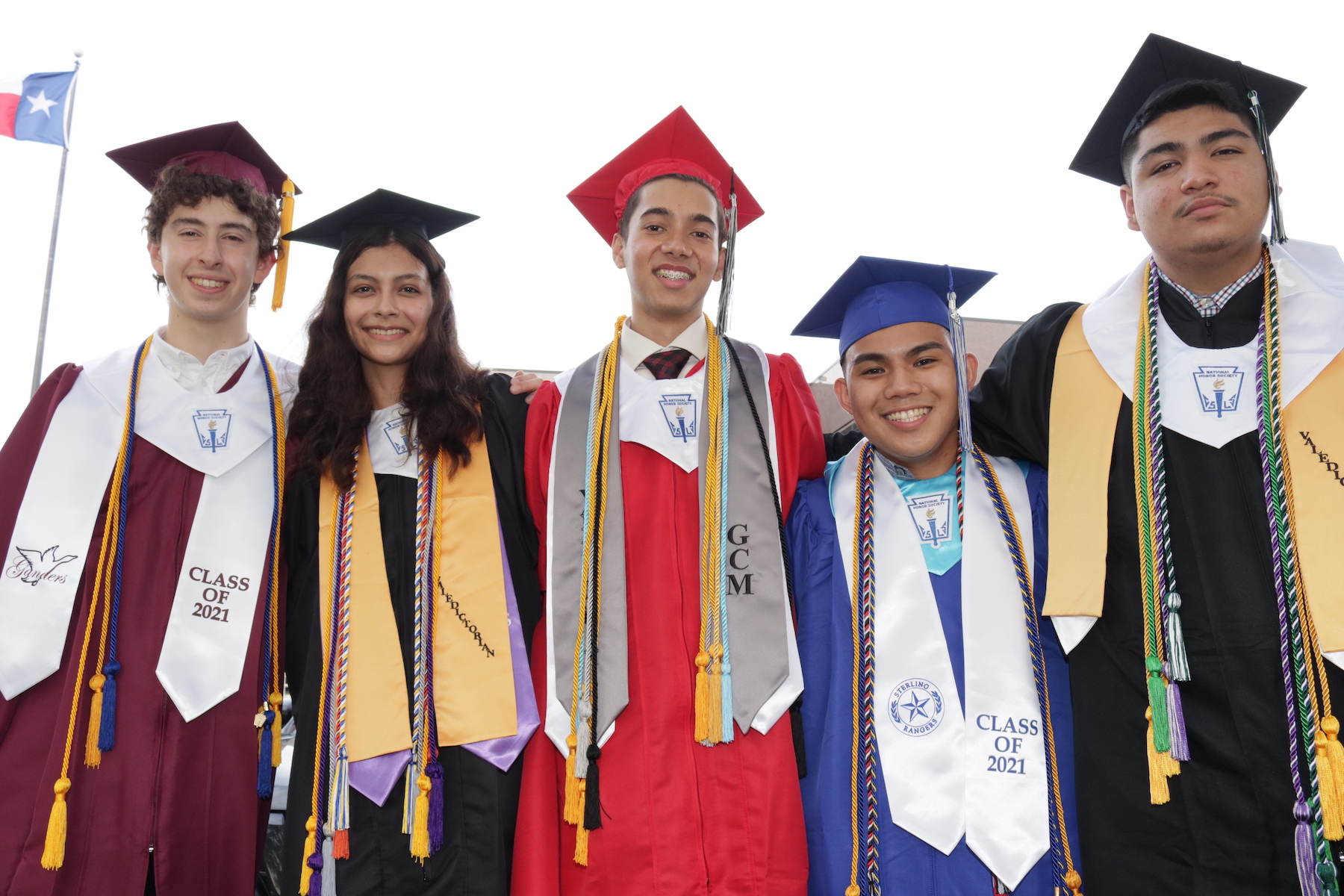 valedictorians from each high school pose together
