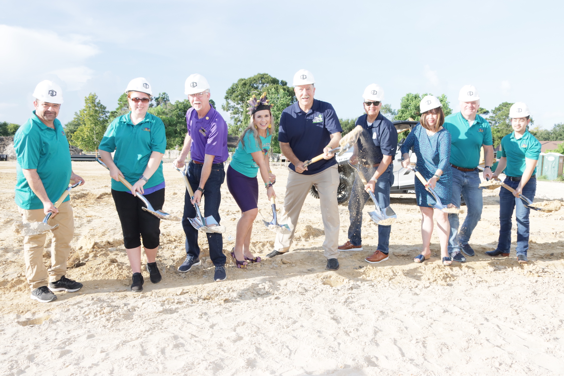 District leaders and architect employees break ground on robotics center