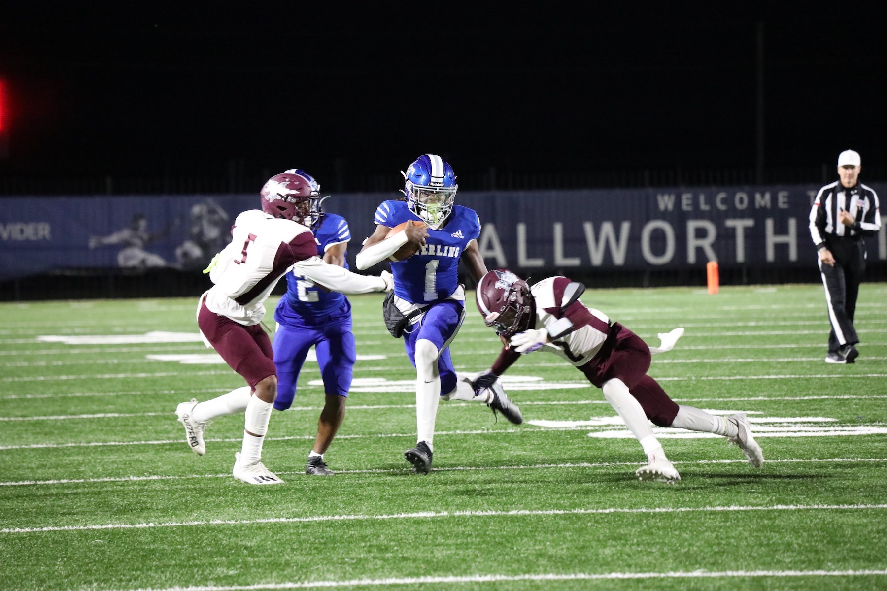 sterling football player dodges lee football players during the game