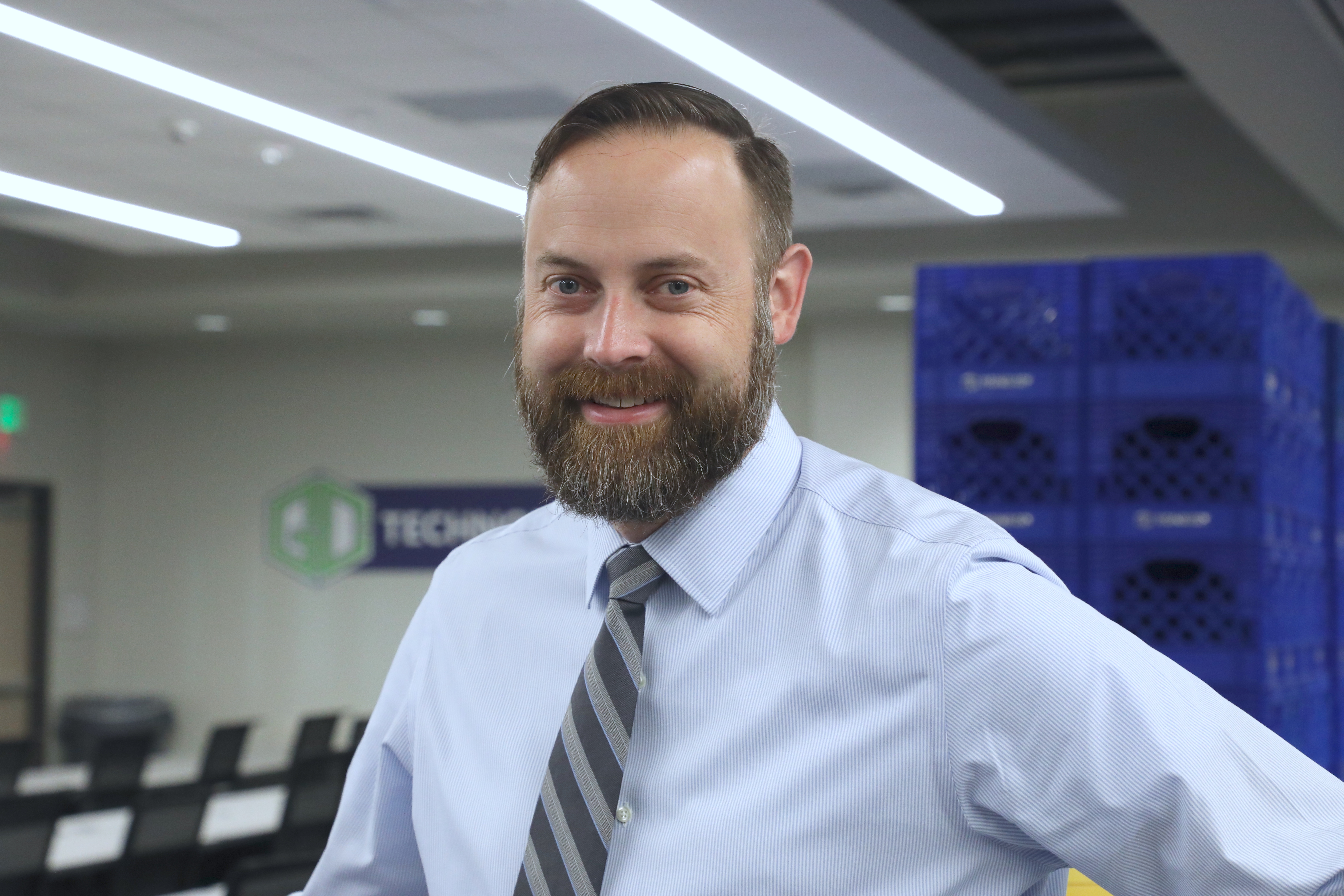 Matt Flood standing in a technology center training room