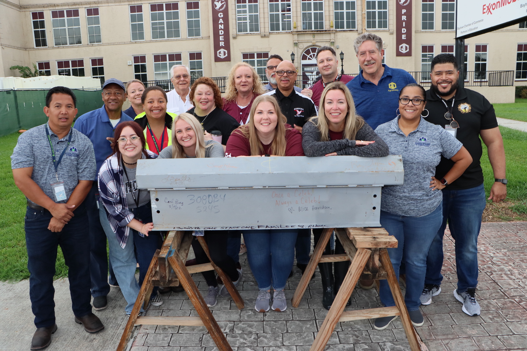 1.	GCCISD staff, students and members of the Citizens Bond Oversight Committee pose with the signed 