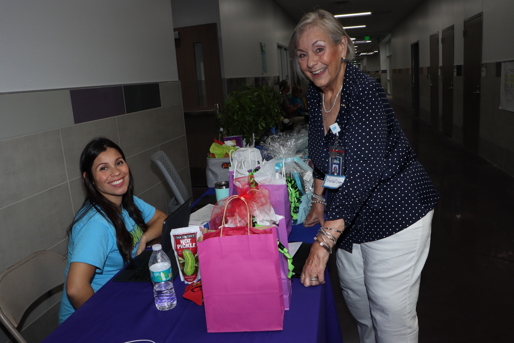 Erika Foster and Brenda Clem pose at the gift table