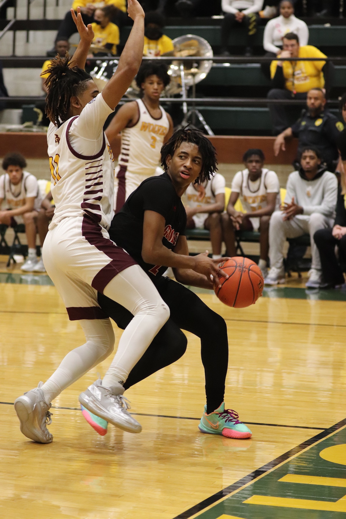 Goose Creek Memorial basketball players tries to get around opponent