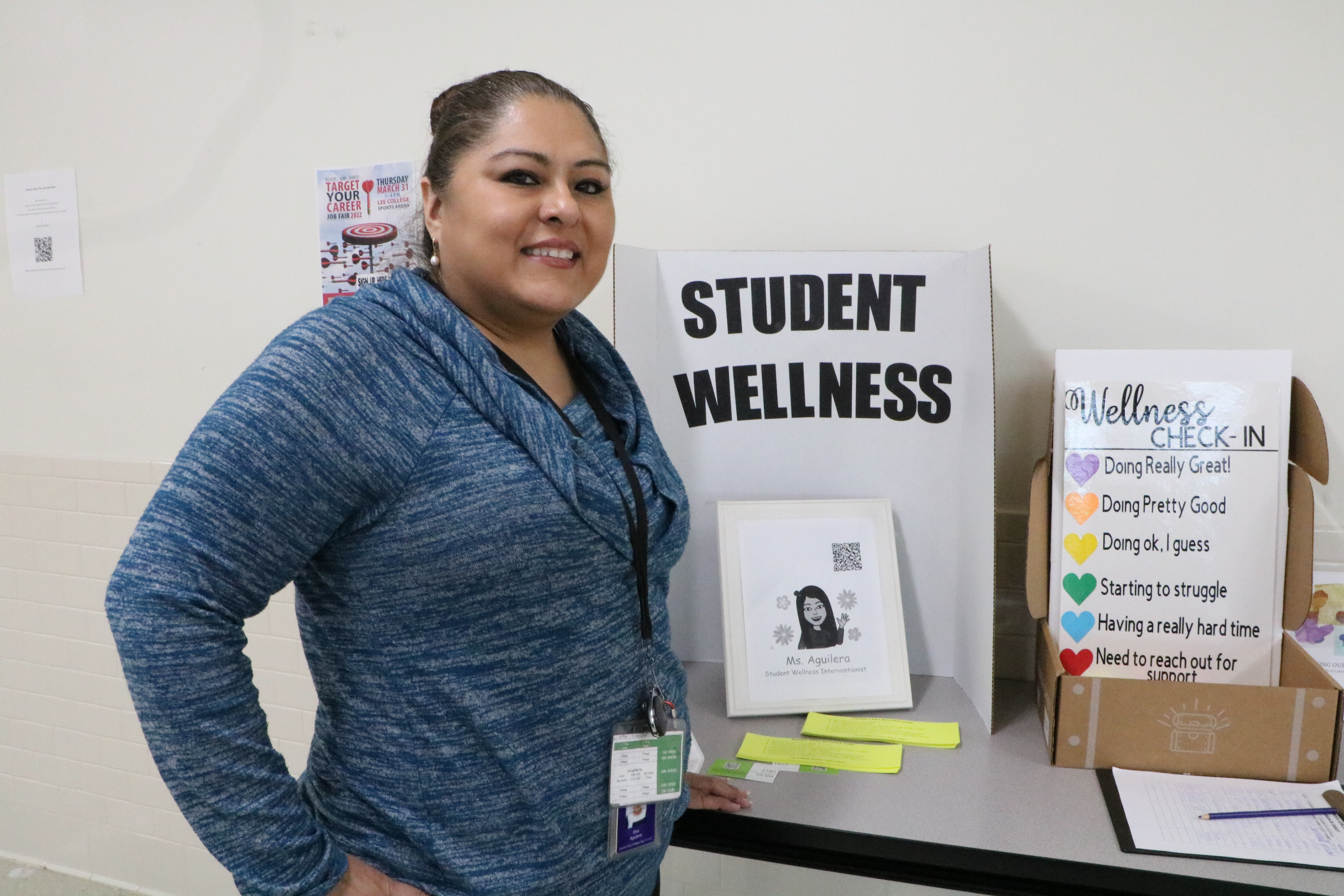 social worker elsa stands in front of resources for students