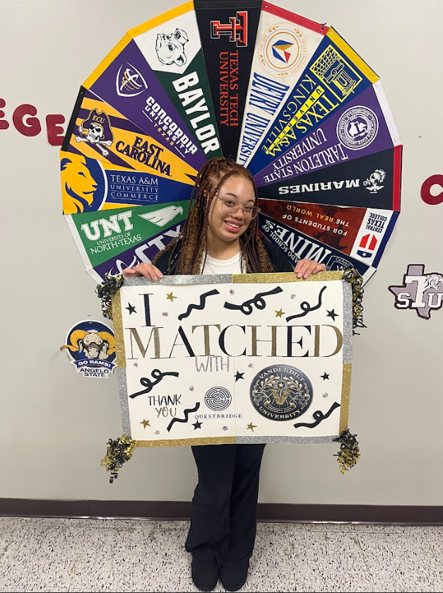 lee student holding poster that states I matched with vanderbilt