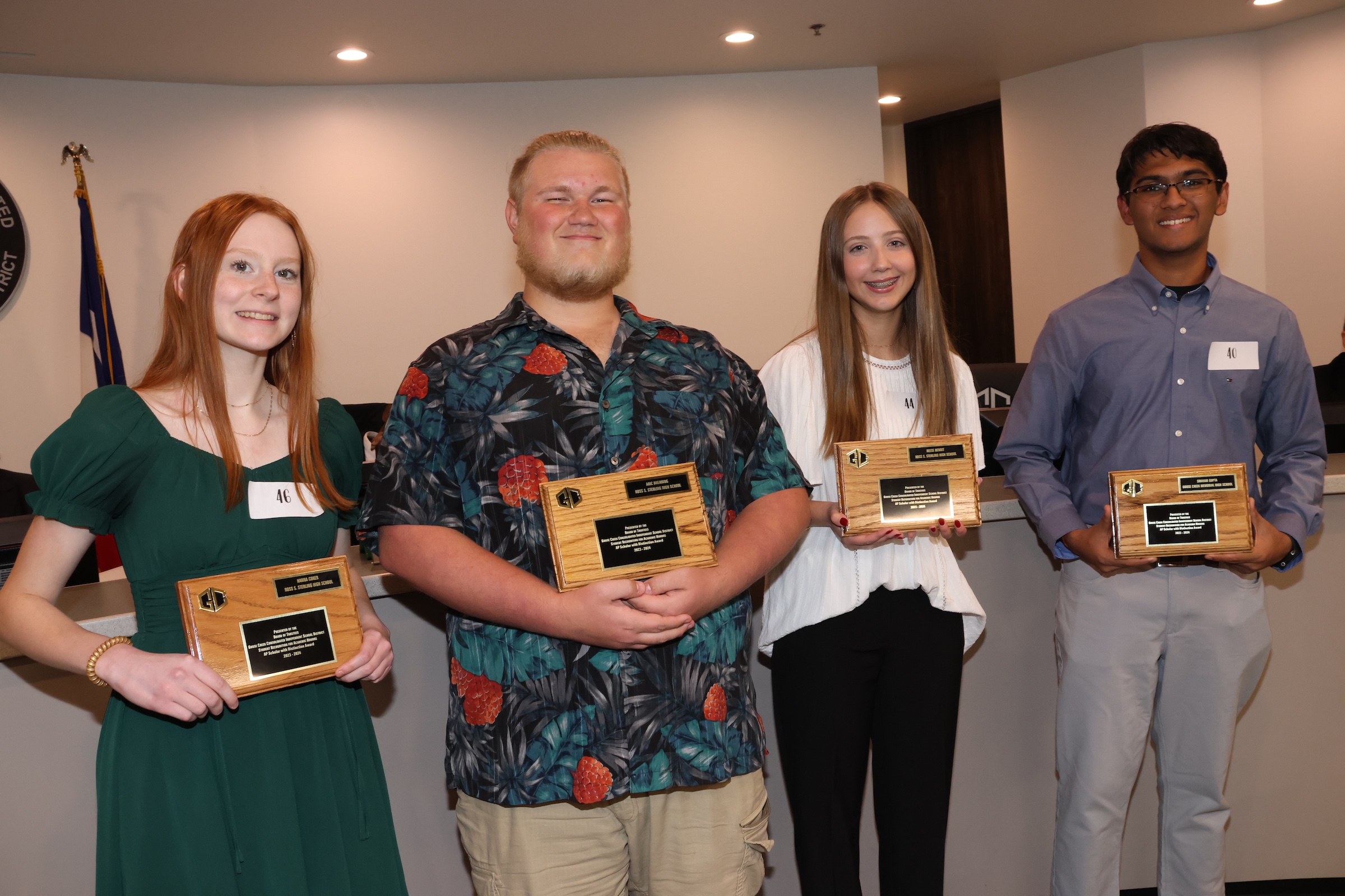 AP Scholars pose with plaques at board meeting