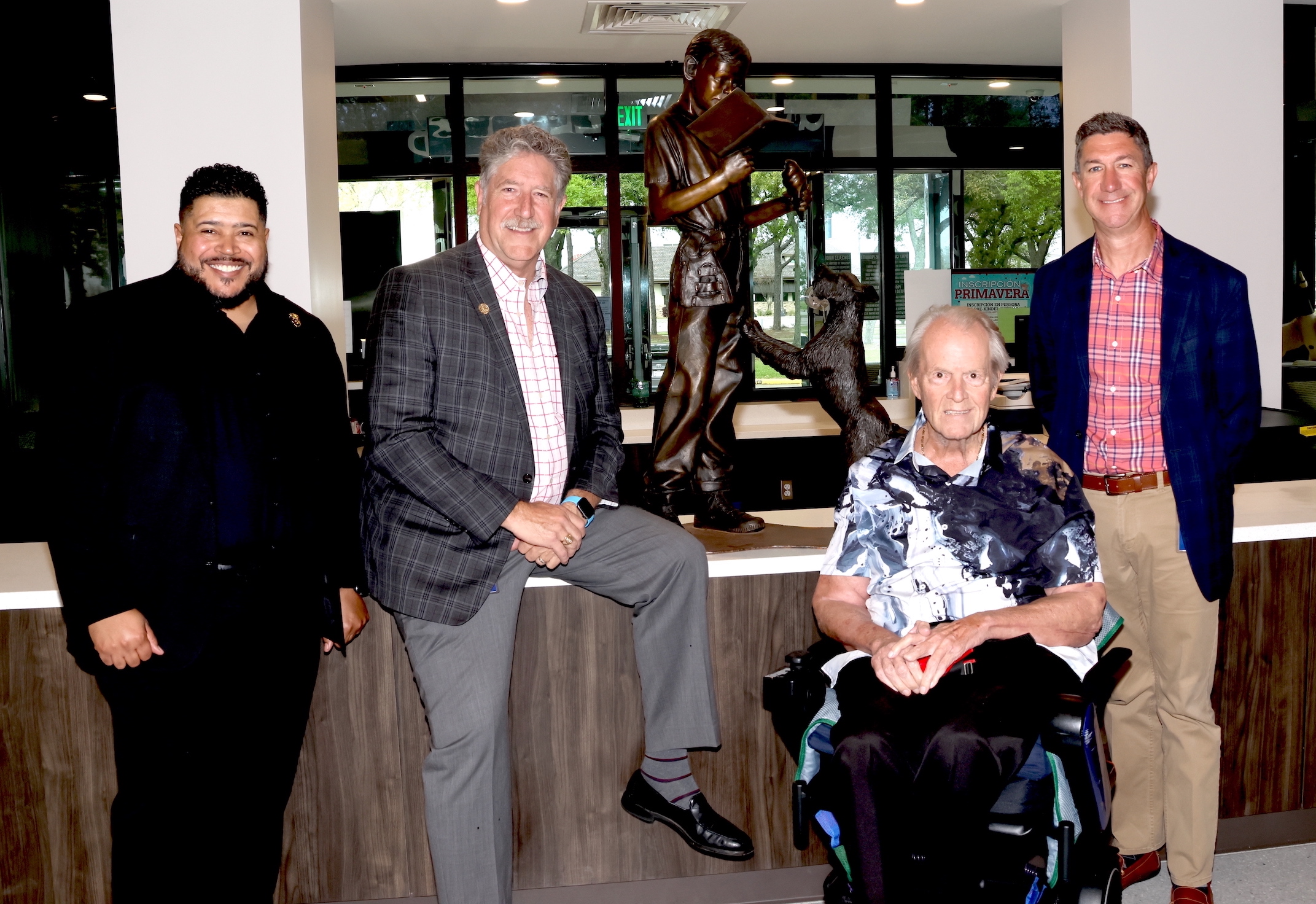 ray lavan, dr obrien, jay eshbach, and matt bolinger pose with sculpture