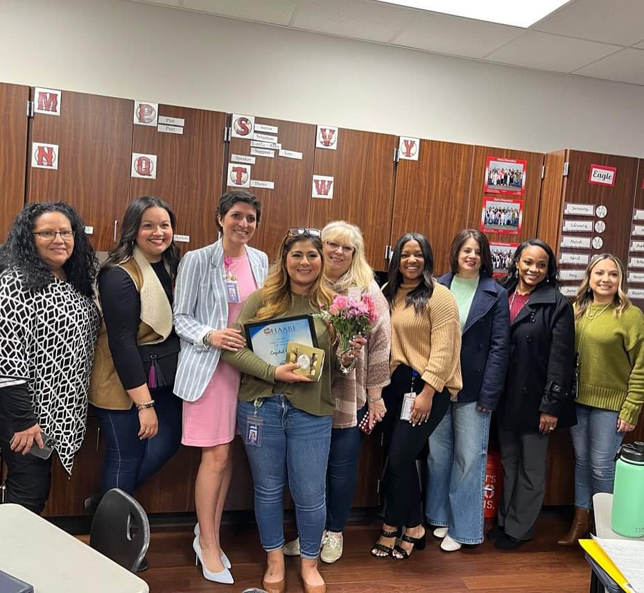 Alamo elementary bilingual teacher of the year poses with admin staff