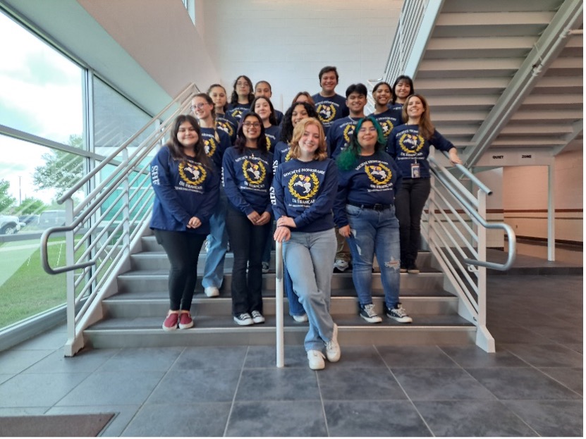 GCM French Honor Society students pose at staircase