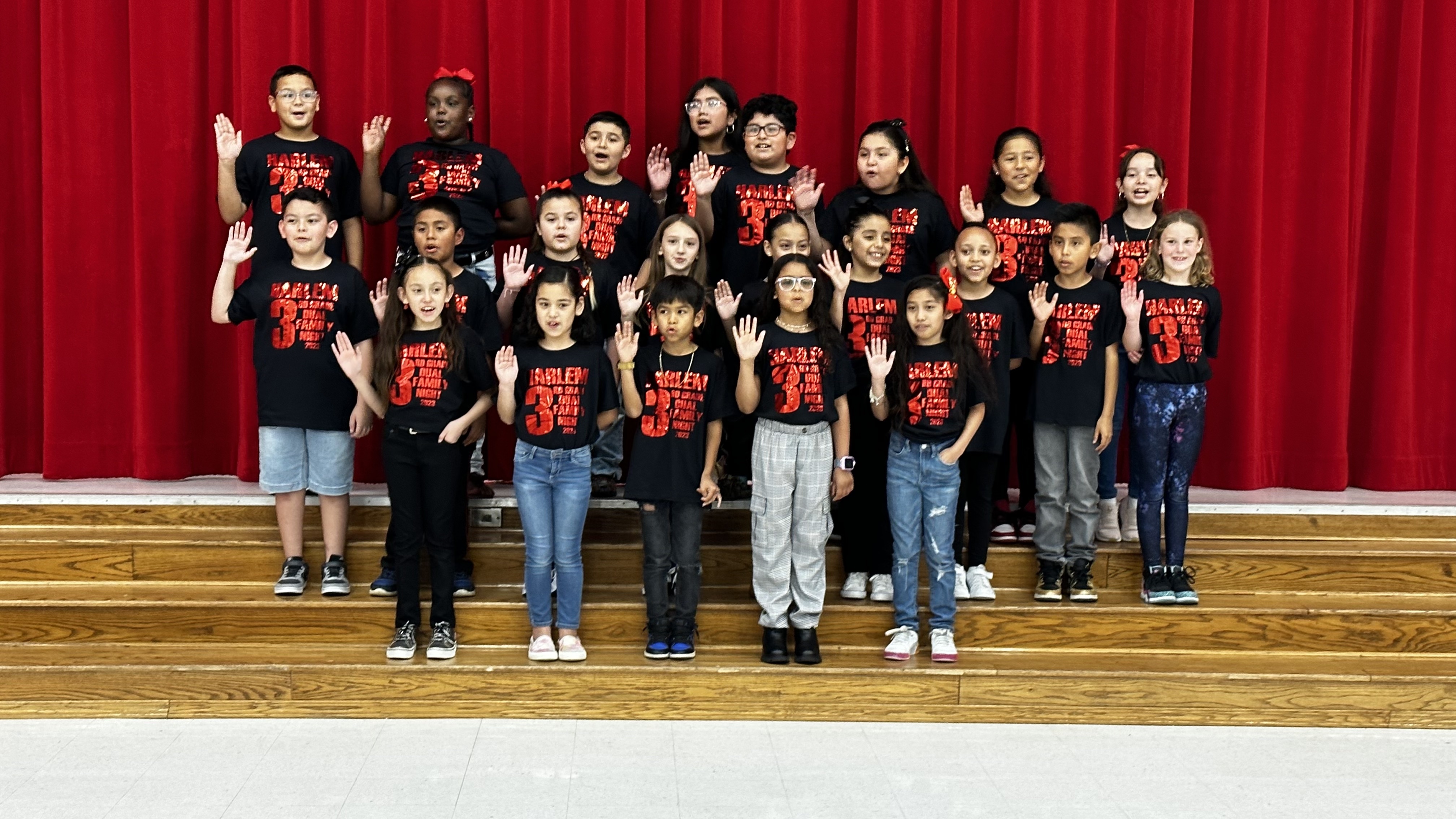 Harlem students sing their anthem in english and spanish