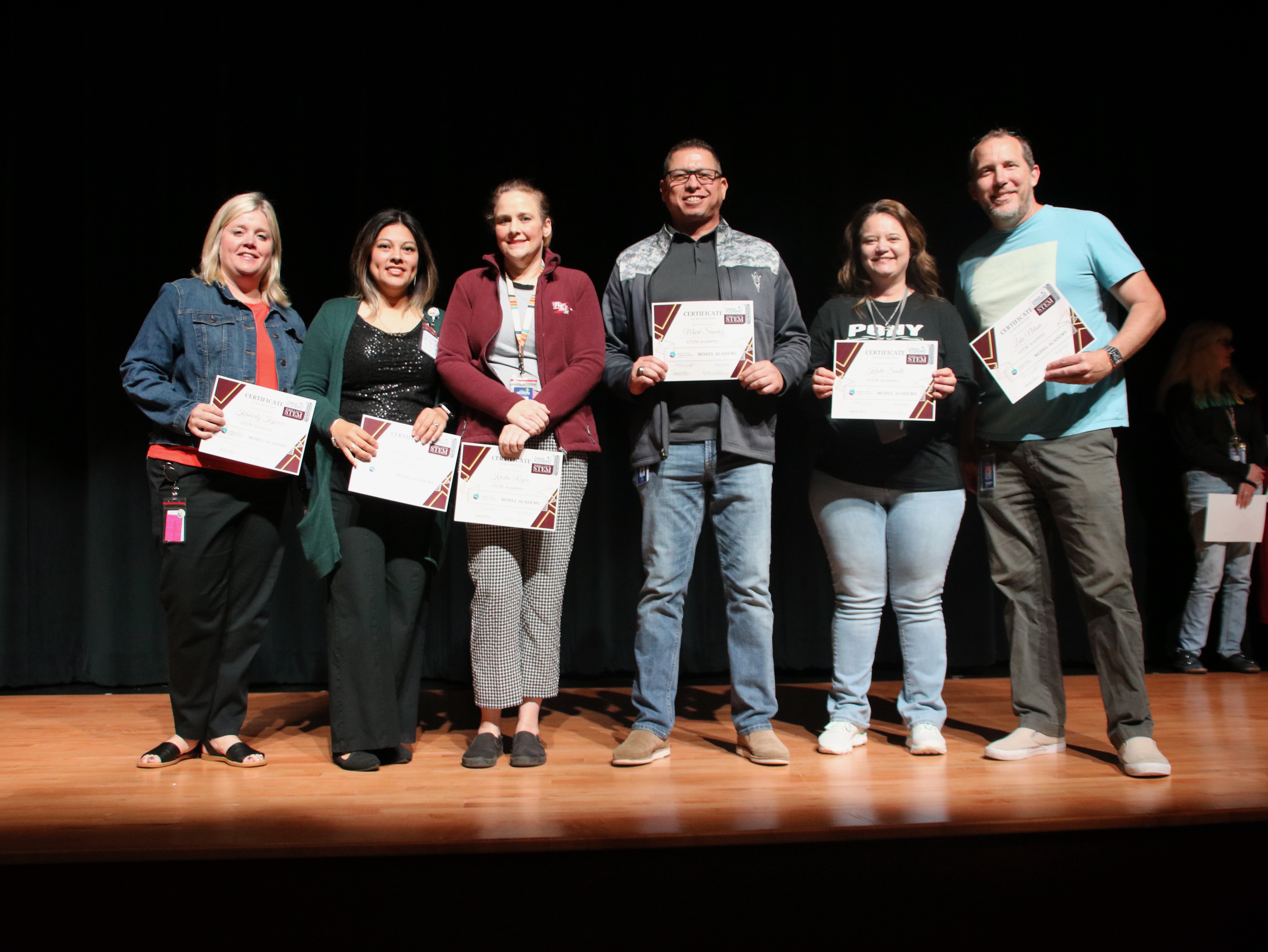 lee stem academy staff pose at surprise presentation event