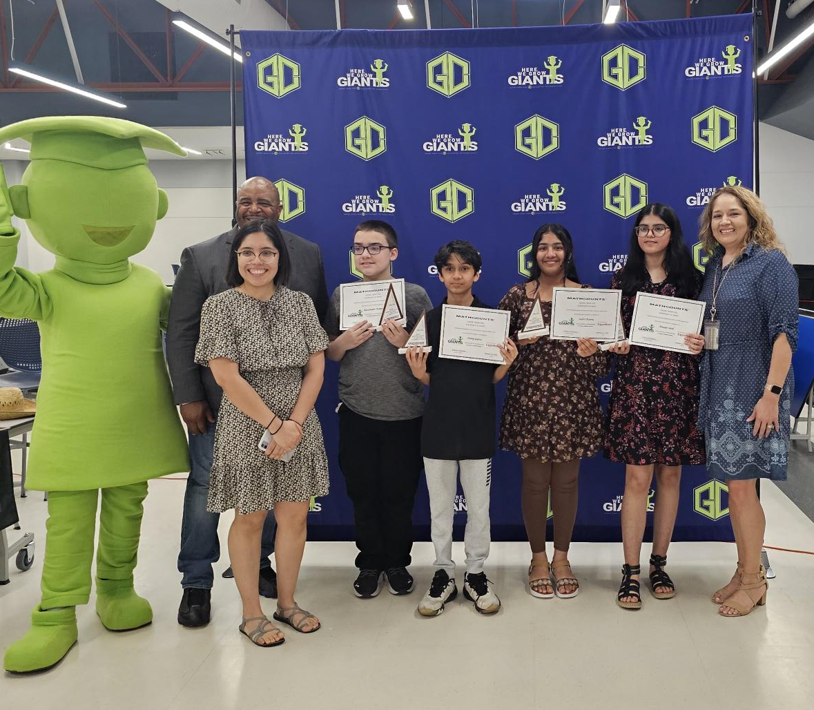 MATHCOUNTS team and administrators pose with award certificates