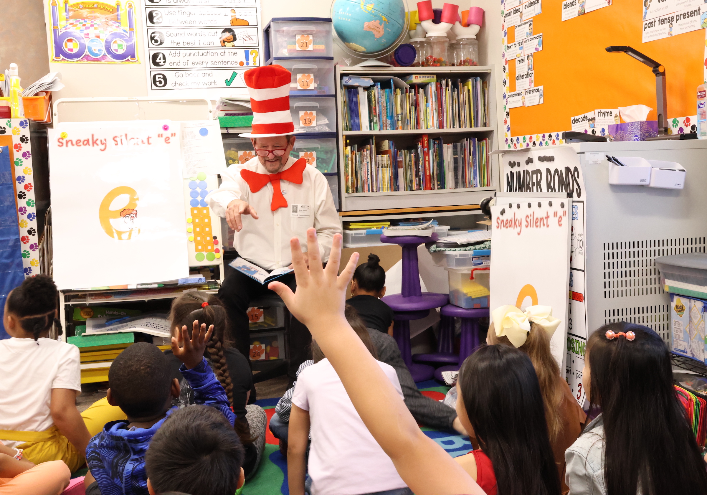 united way representative reads to students in a classroom