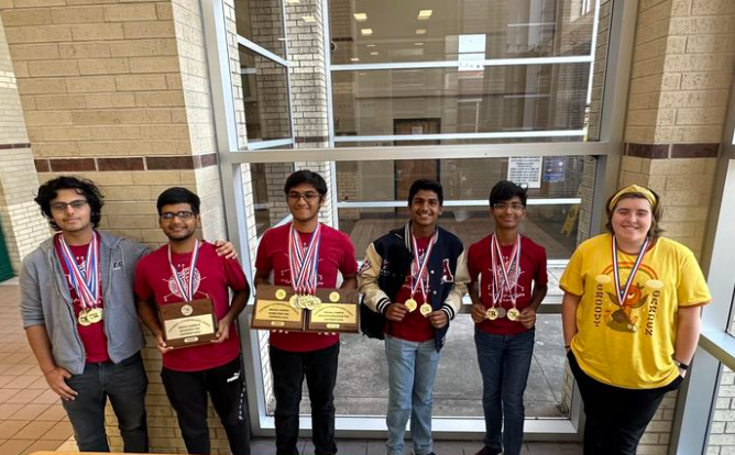 Math competitors pose with trophies 