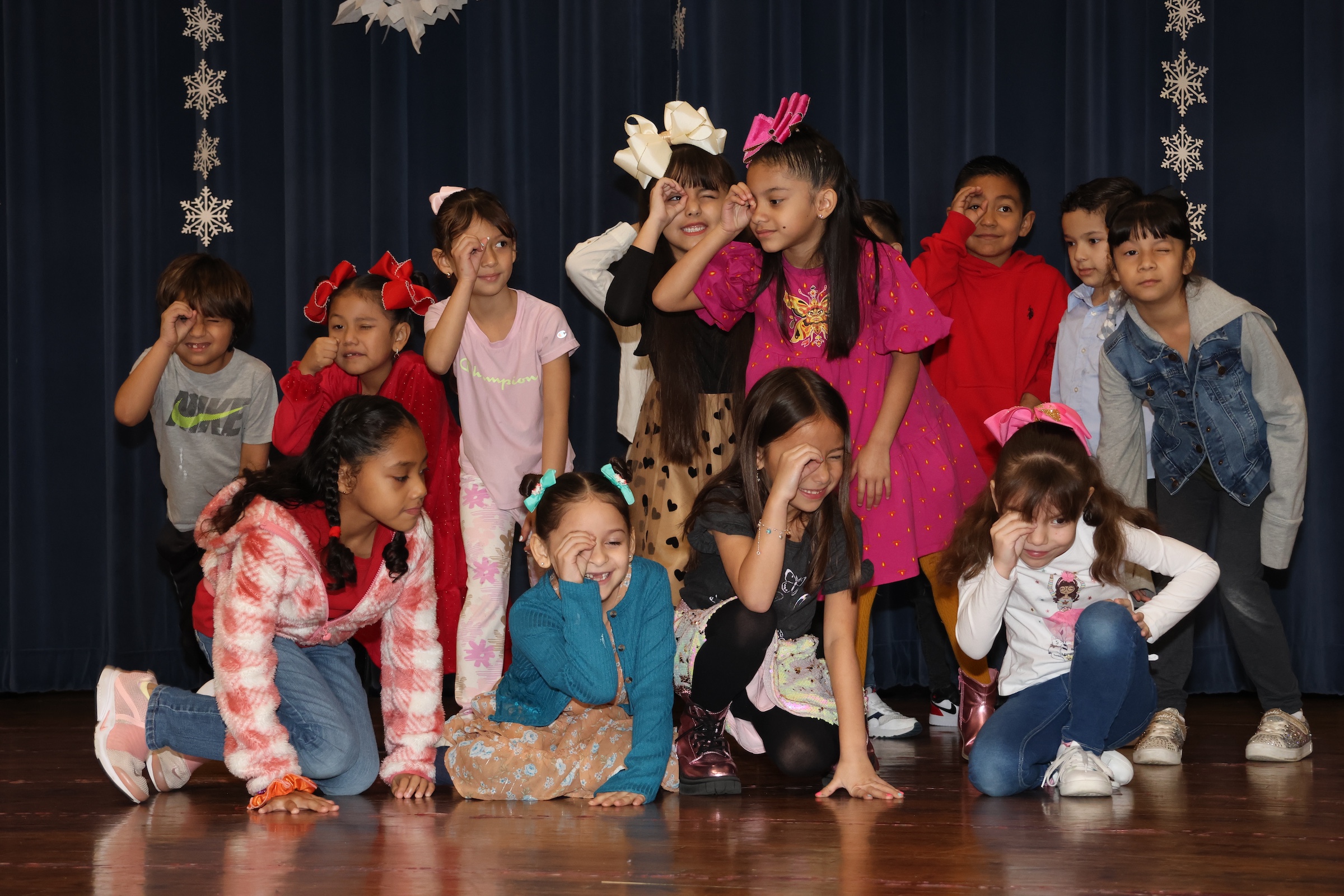 Students perform as jungle detectives on stage