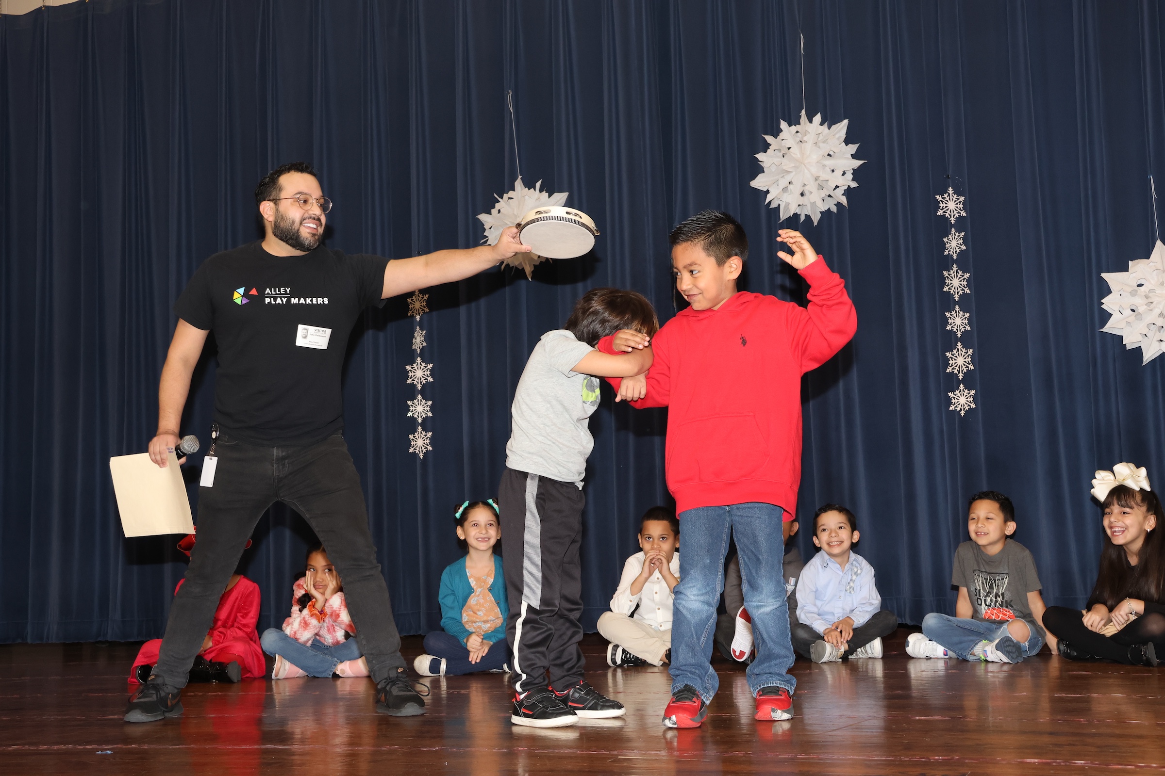 Alley Theatre educator and students work as pet detectives on stage