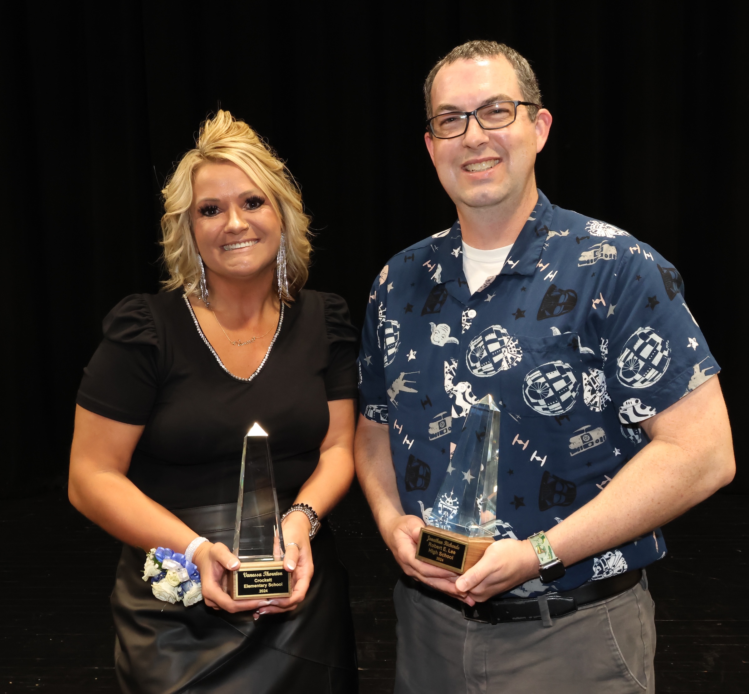 District teachers of the year pose with awards