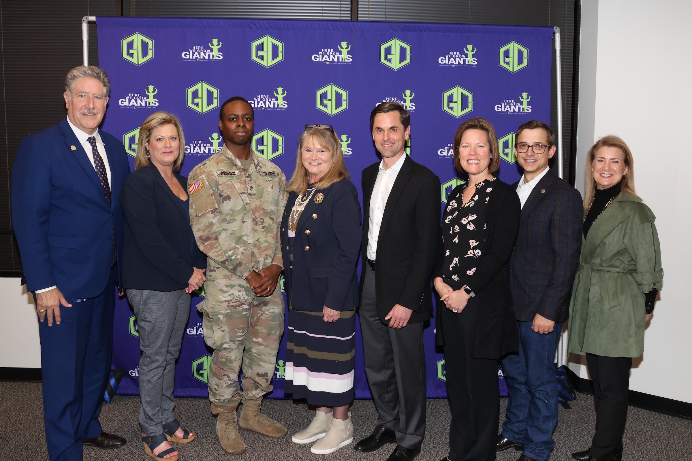 board members pose with senator, state representative, and district director for state rep