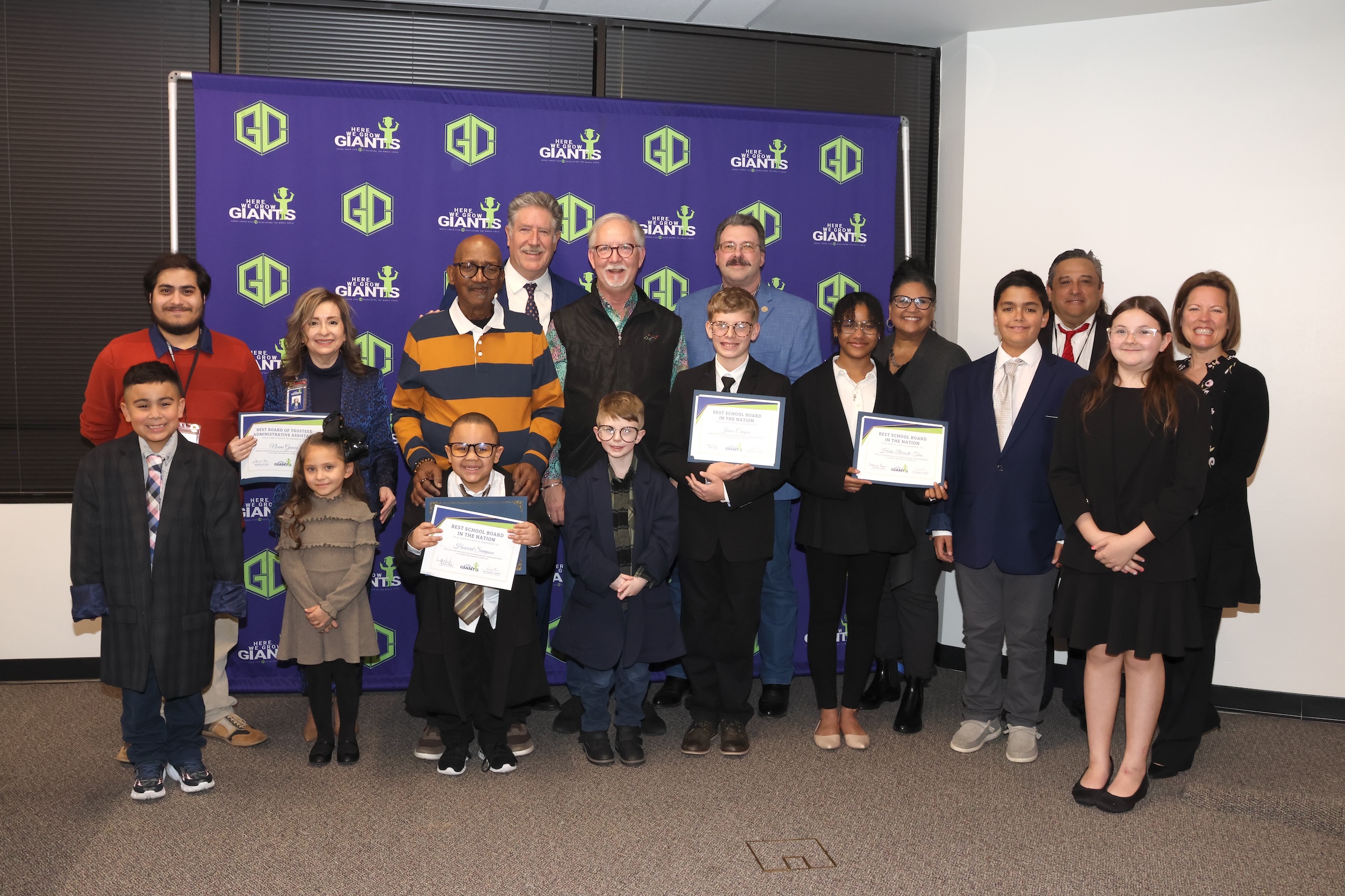 board members pose with their student actors