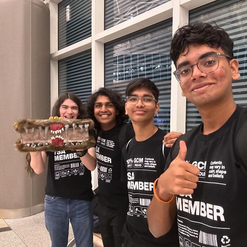 students pose with tsa project
