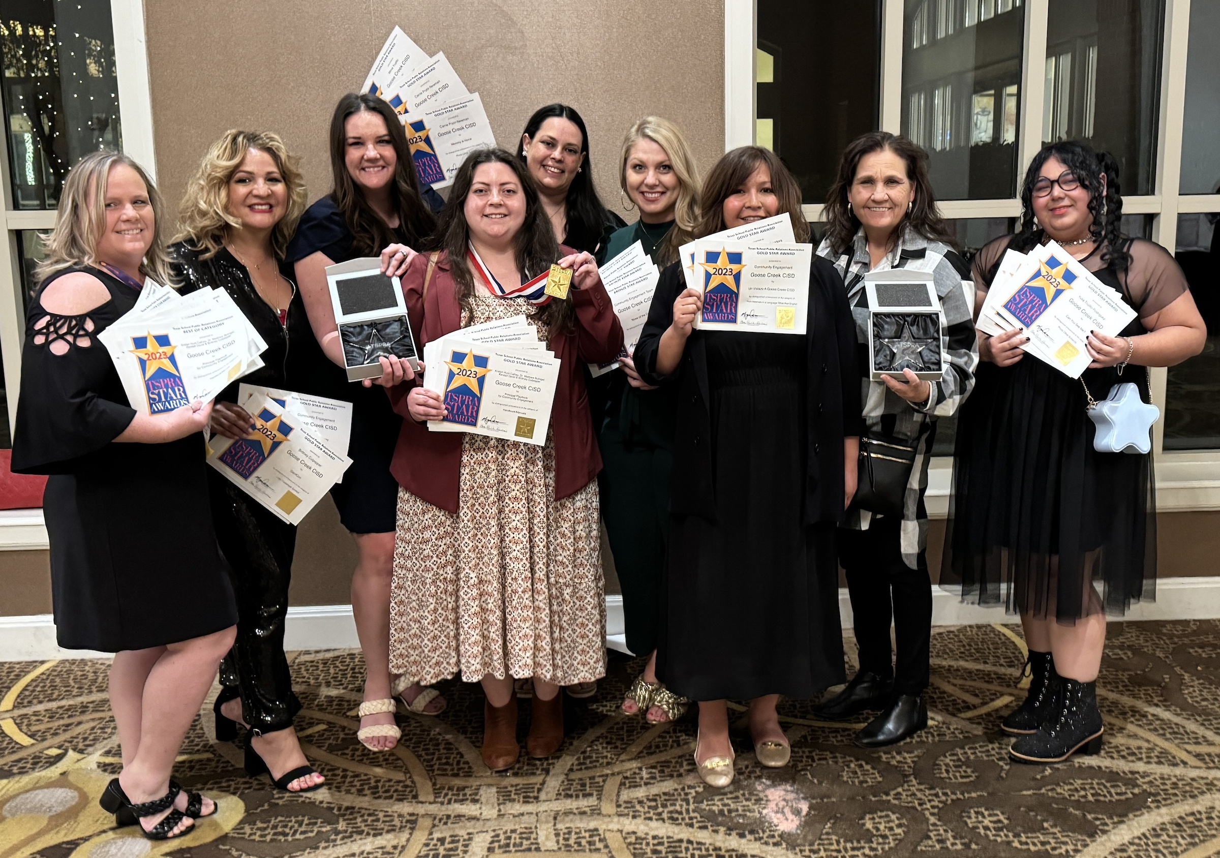 GCCISD Community Engagement Team poses with awards