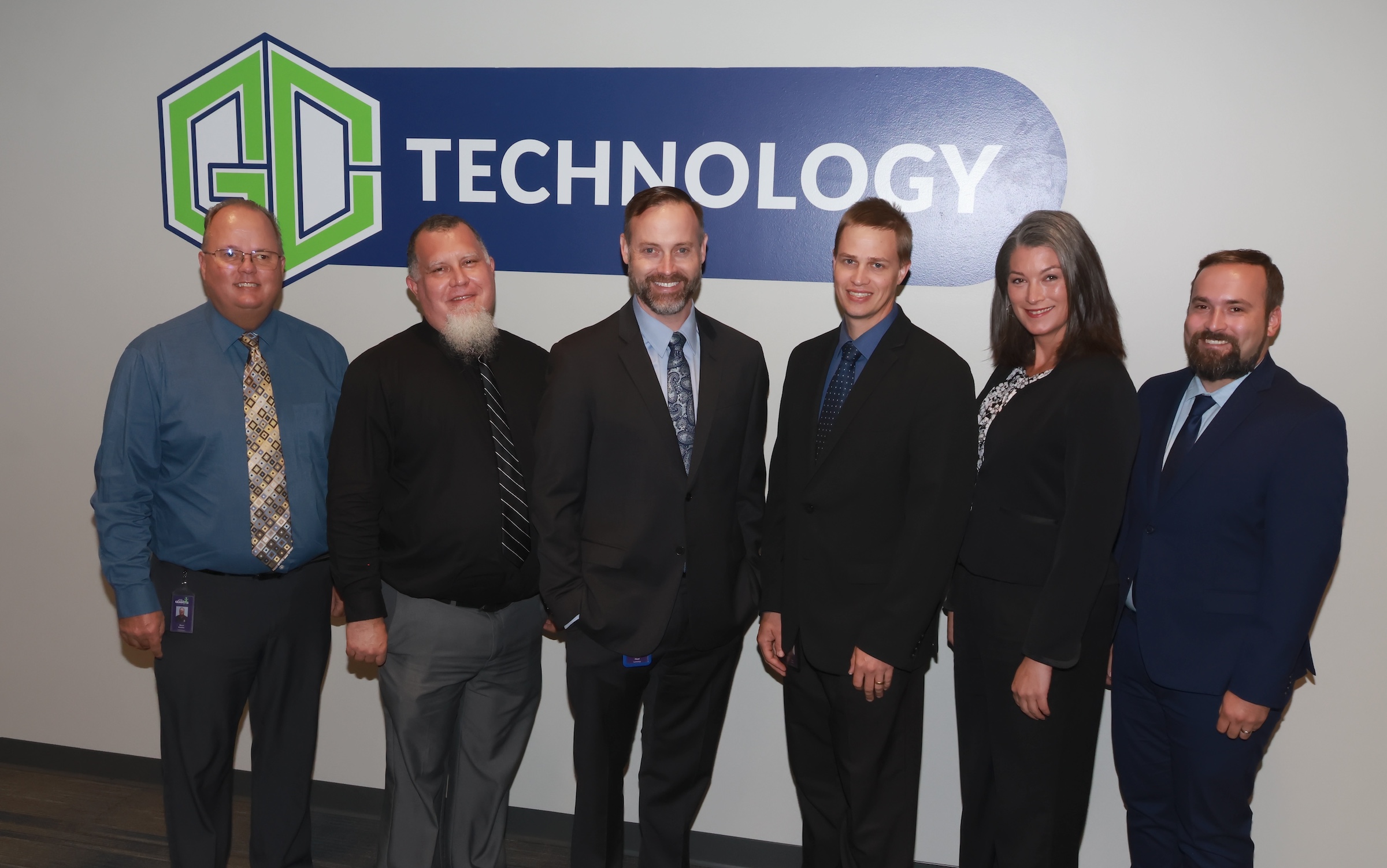 technology administrators pose for tle seal