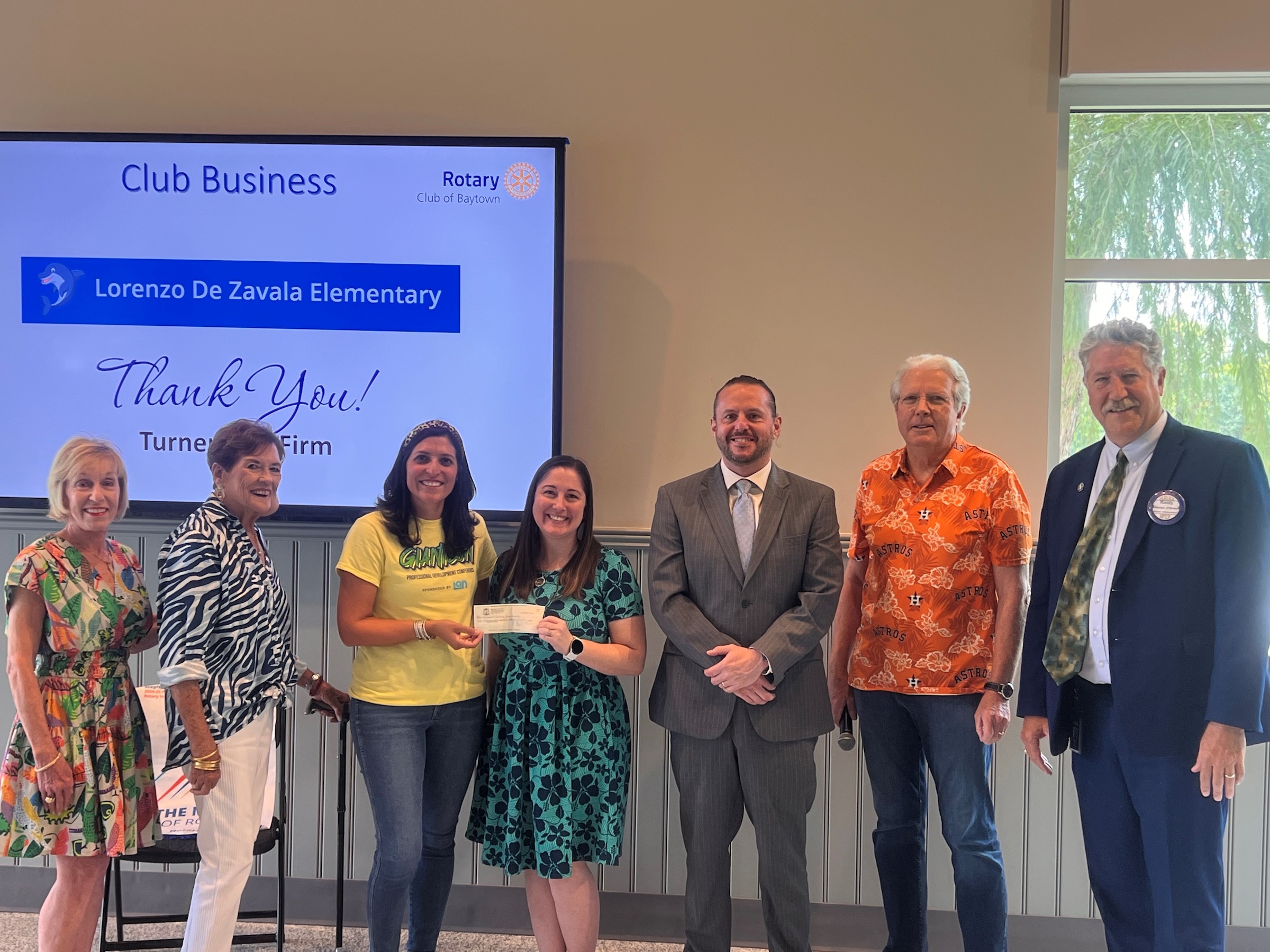 Members of Rotary, Campus Administration, and Dr. Randal OBrien pose with check.