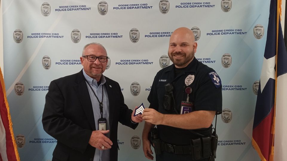 Interim Chief Bonsal presents Sergeant Mason with his chevrons