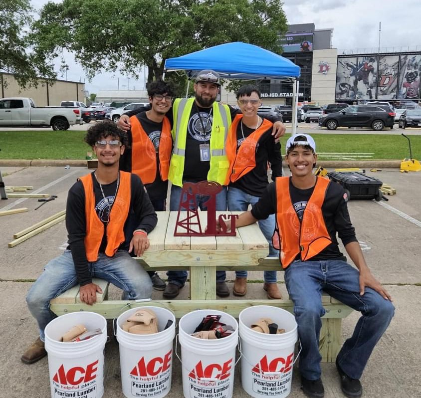 RSS Construction Team pose with construction teacher mr. serrano