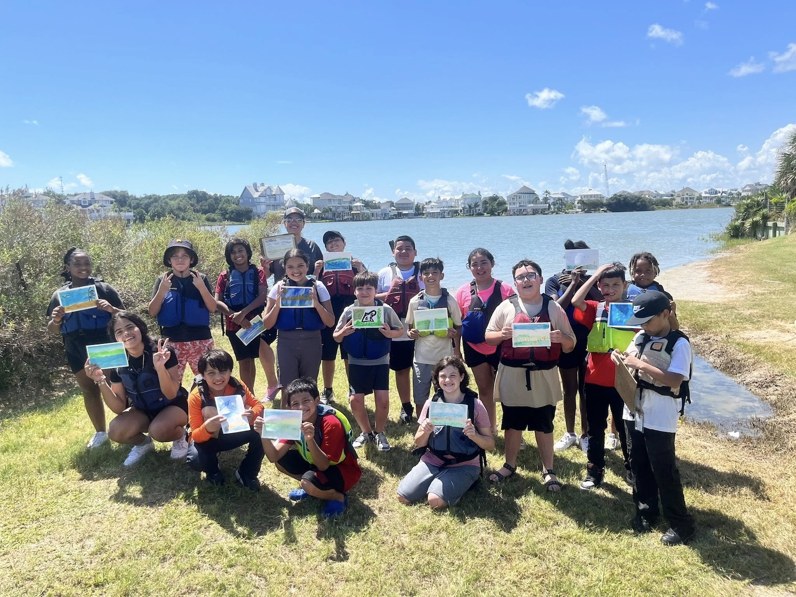 CBJ STUDENTS POSE IN FRONT OF LAKE
