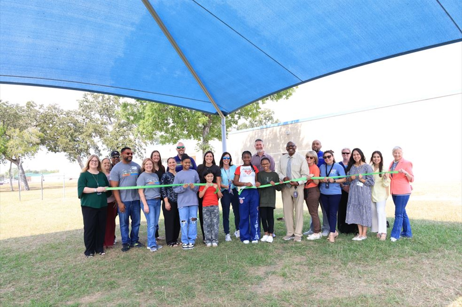 GCCISD staff, students and reps from Md Anderson have a ribbon cutting for new sunshade