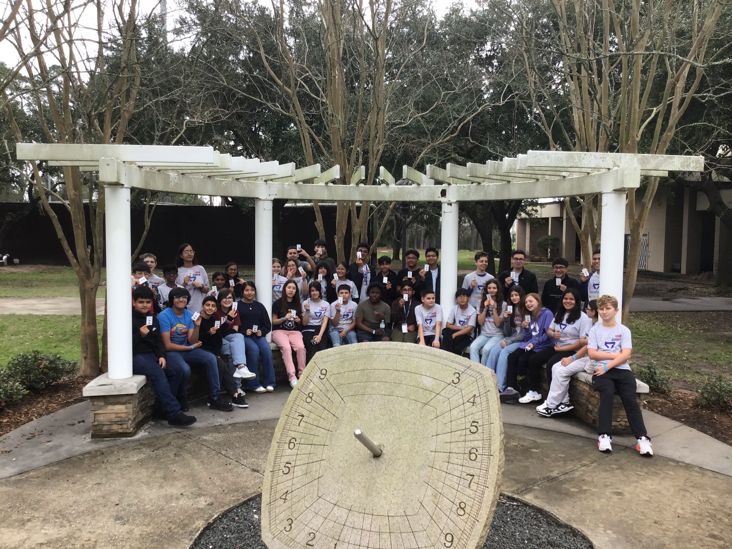 students from all junior highs pose with mathcounts medals