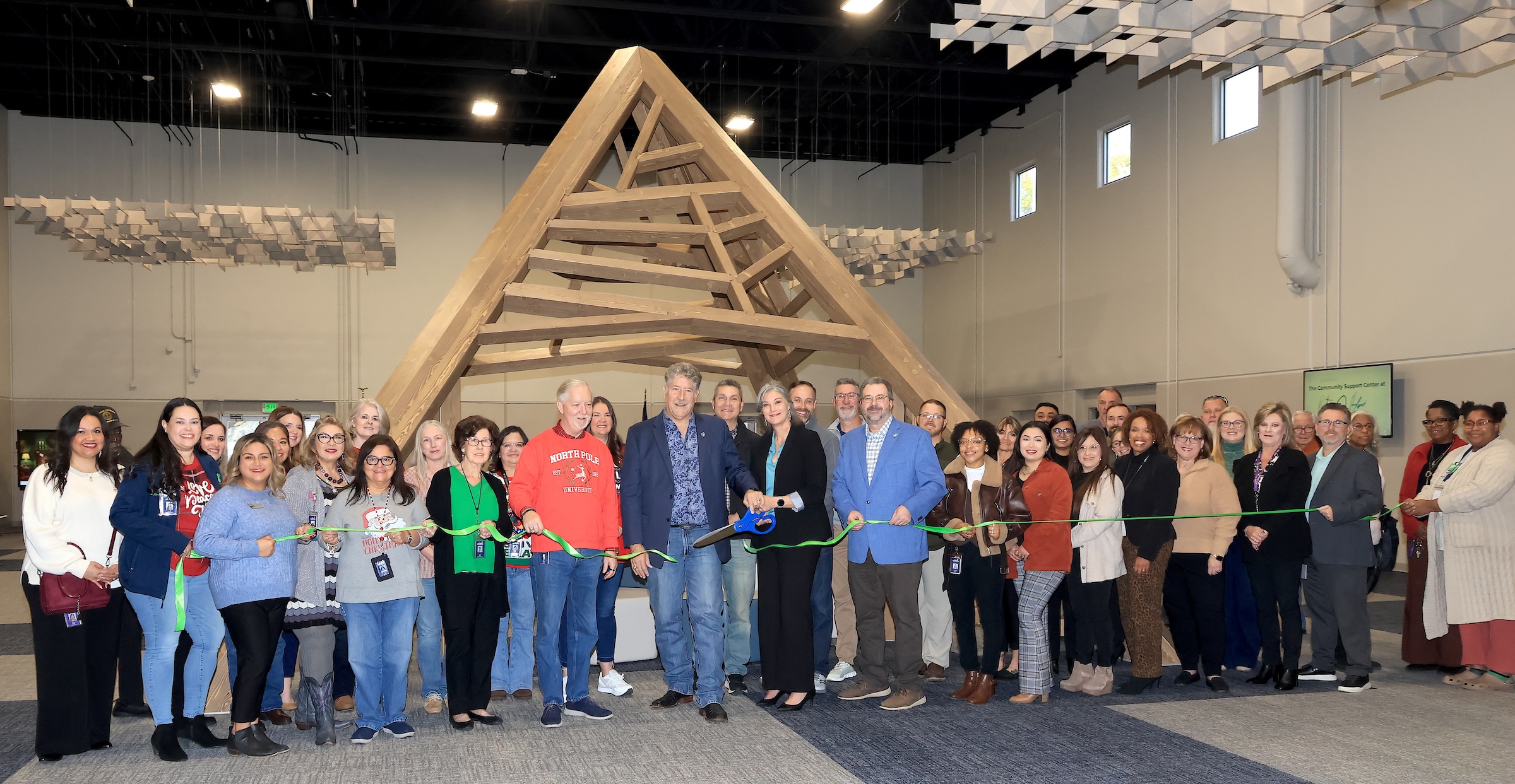 Empower Academy staff, district leaders, and community partners gather to mark this milestone