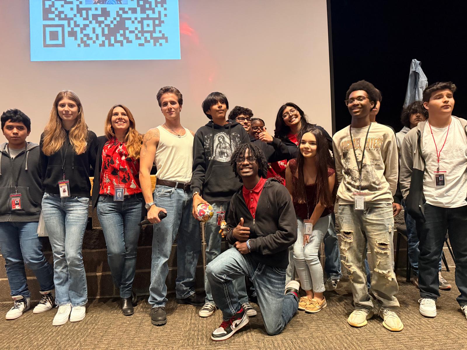 teo bok with students posing in front of gcm stage