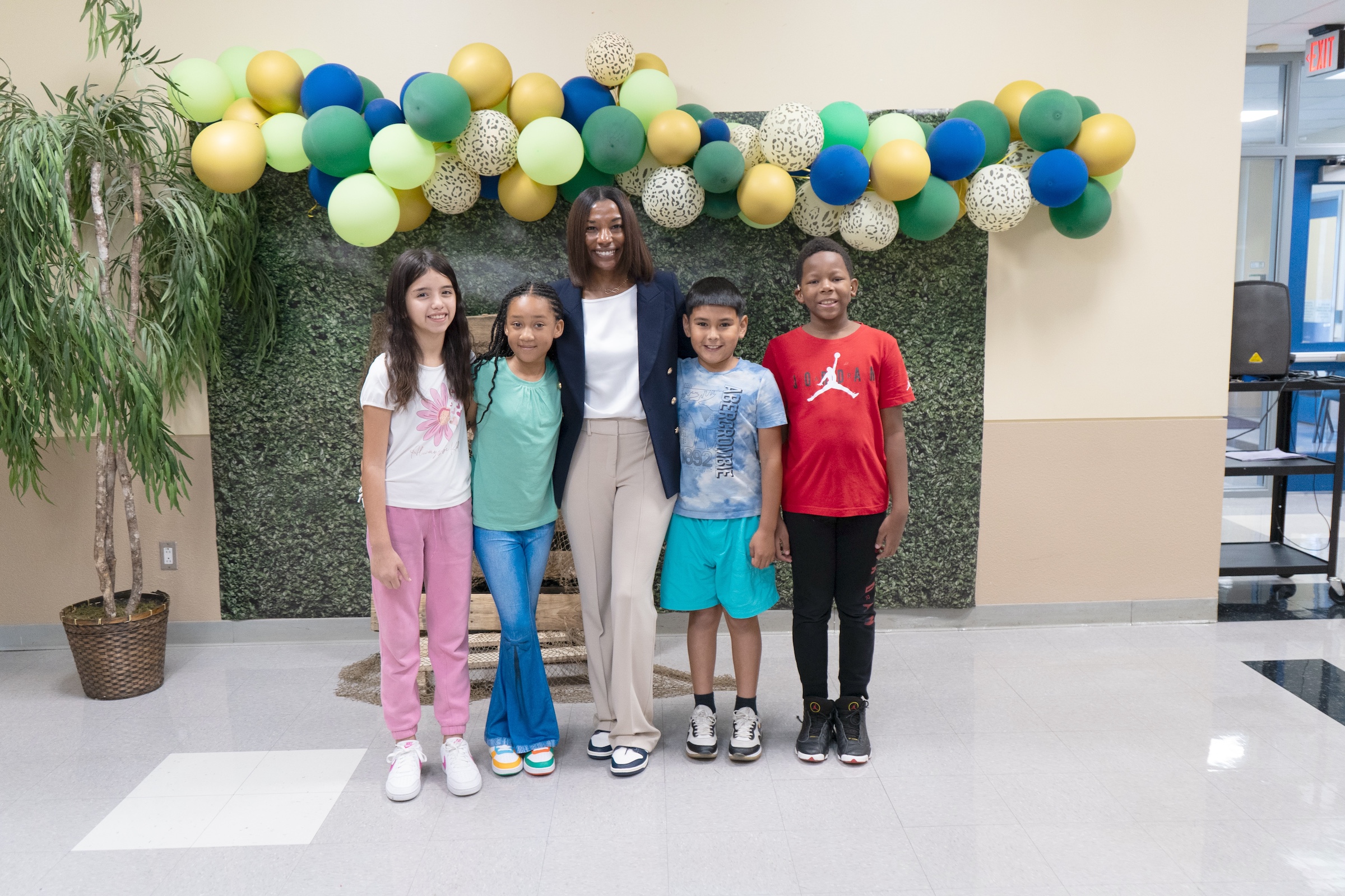 lacee gordon stands in the school hallway with students