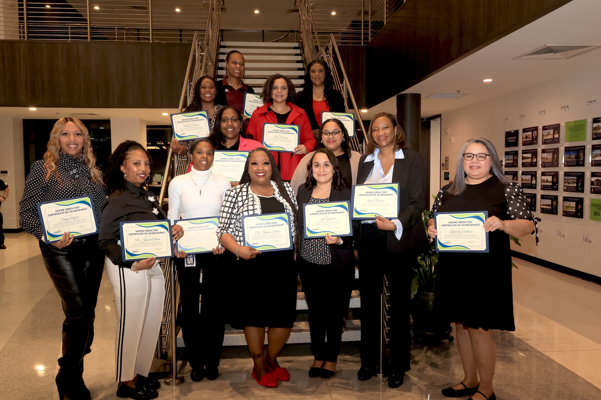 HAASBE teachers posing in front of a staircase